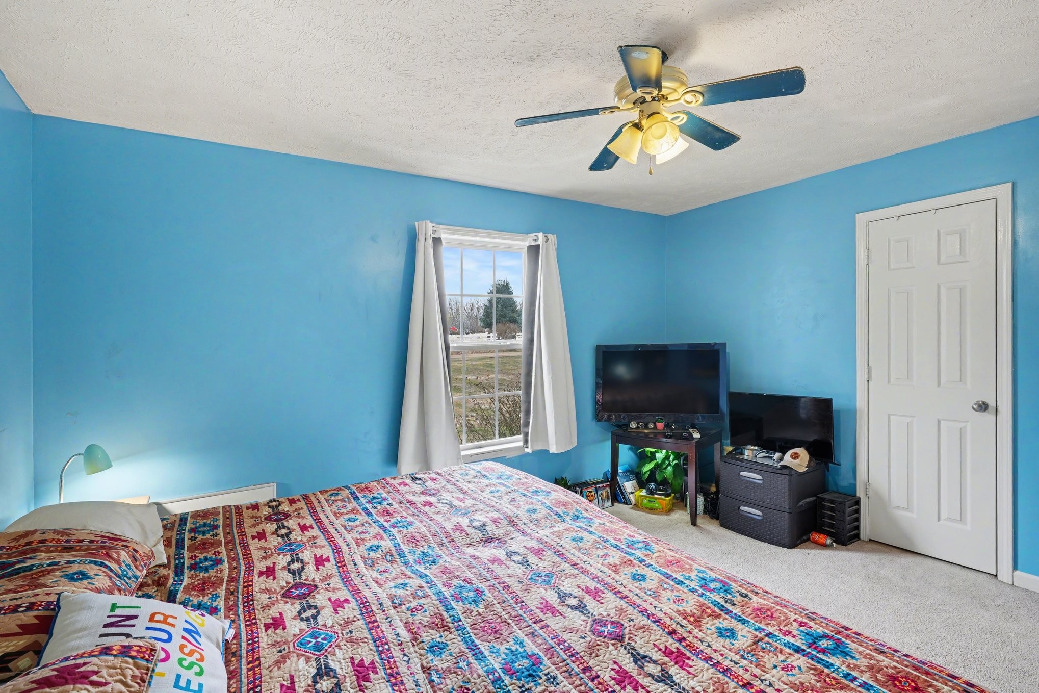 2490 Monte Murrey Road Lewisburg, TN 37091 - Photo 17 of 30 a bedroom with a bed and a chandelier