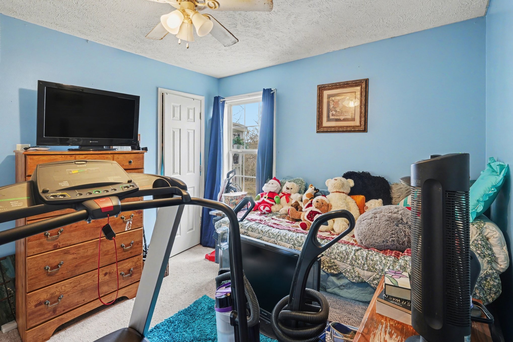 2490 Monte Murrey Road Lewisburg, TN 37091 - Photo 19 of 30 a bedroom with furniture and a flat screen tv