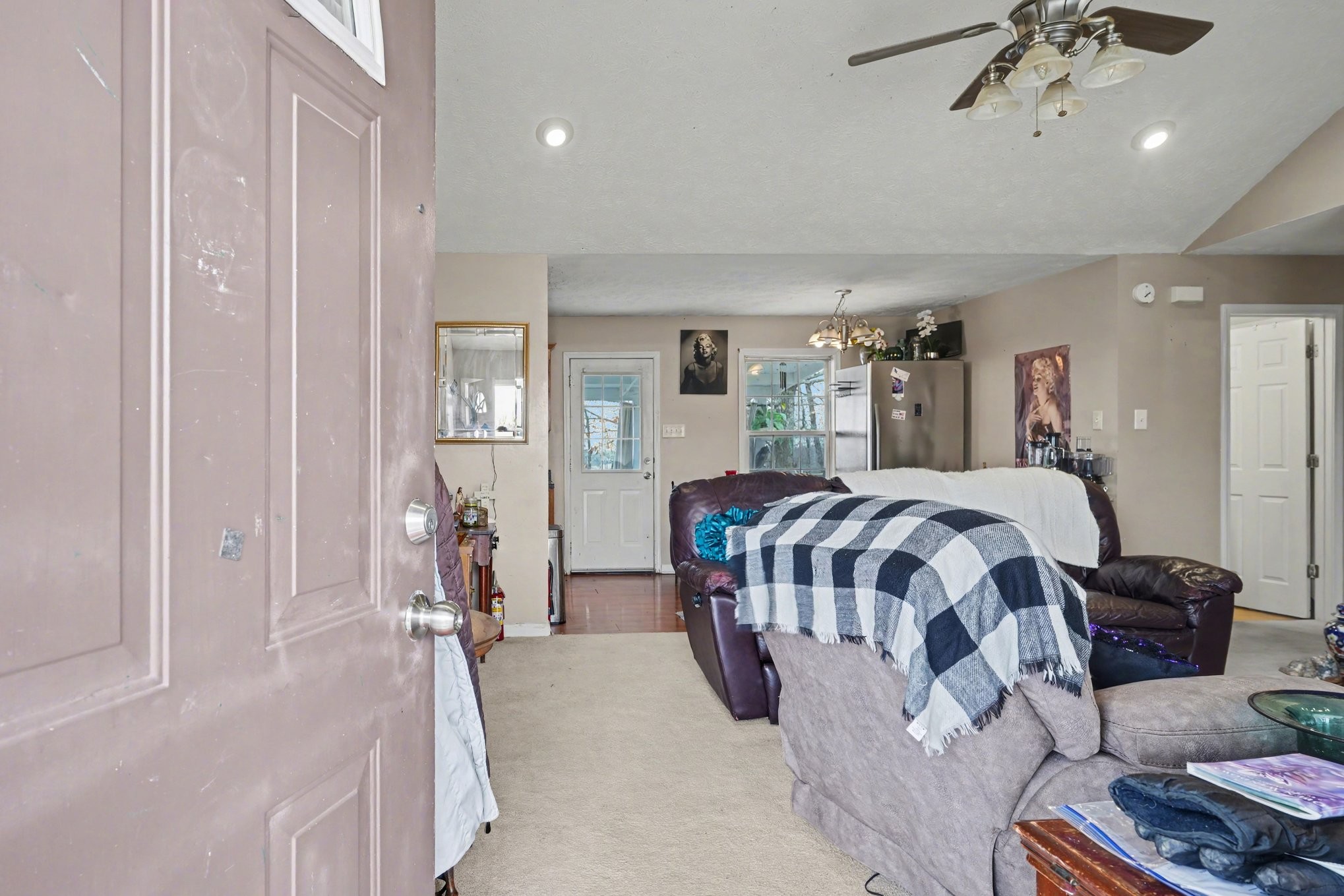 2490 Monte Murrey Road Lewisburg, TN 37091 - Photo 4 of 30 a spacious bedroom with a large bed and a chandelier