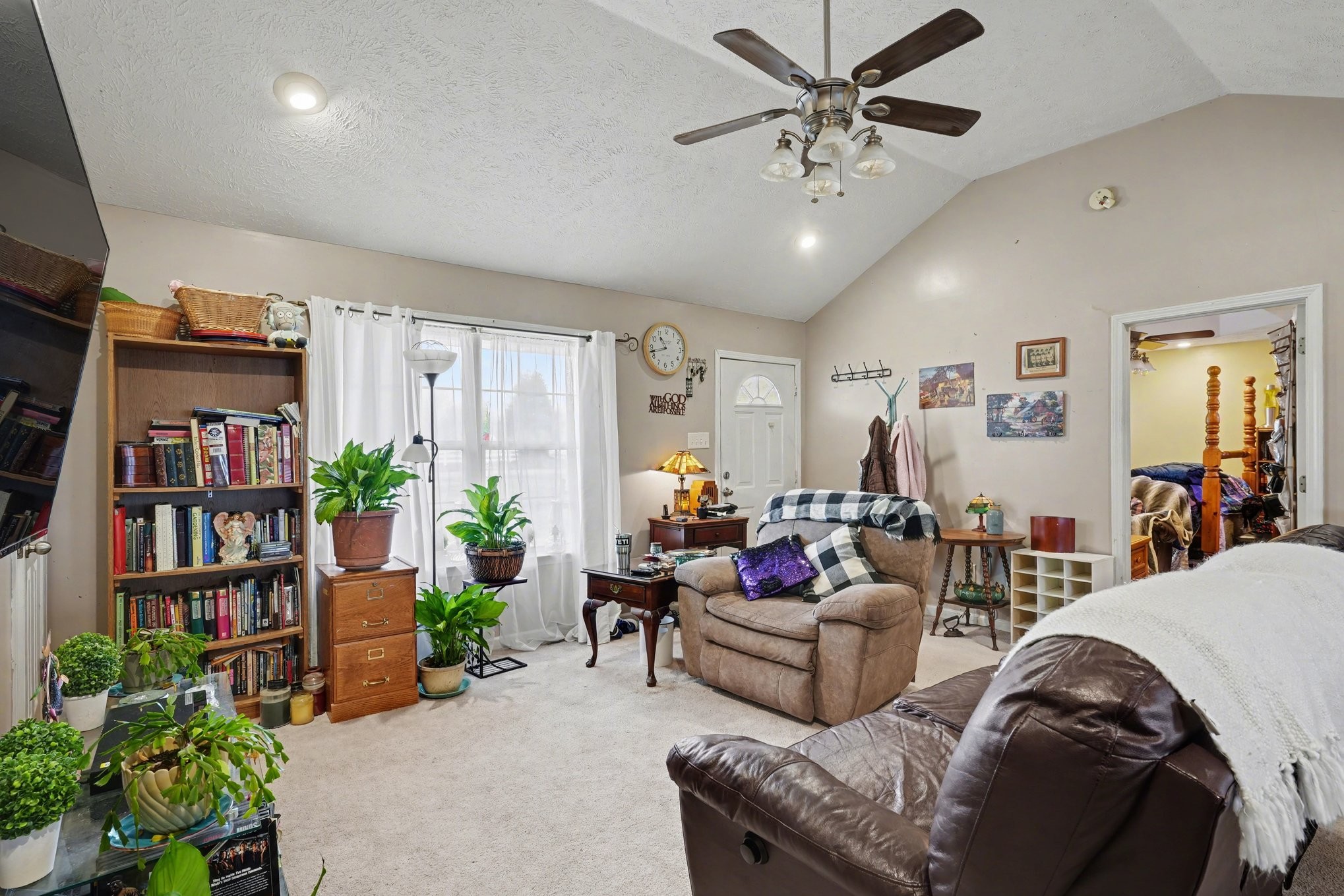 2490 Monte Murrey Road Lewisburg, TN 37091 - Photo 8 of 30 a living room with furniture or bookshelf and a potted plant
