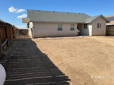 1640 South Mahan Street Ridgecrest, CA 93555 - Photo 24 of 27 a front view of a house with a yard