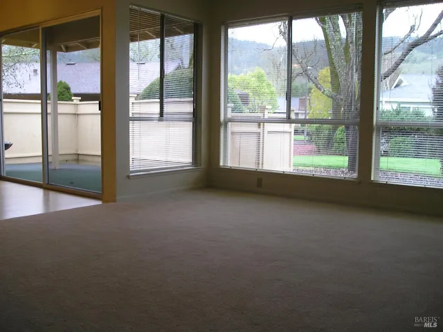 a kitchen with granite countertop a sink stove and microwave