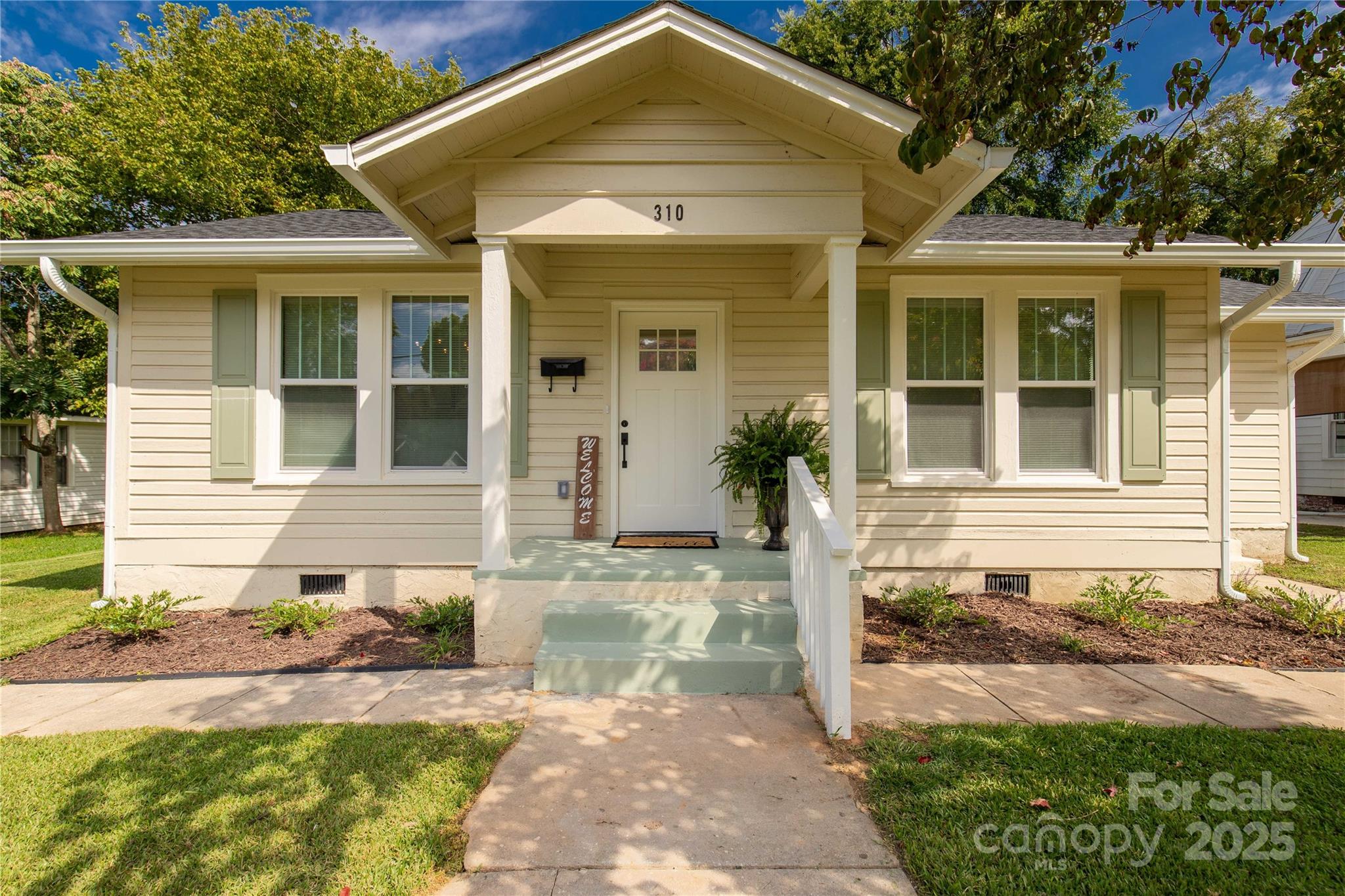 front view of a house with a yard
