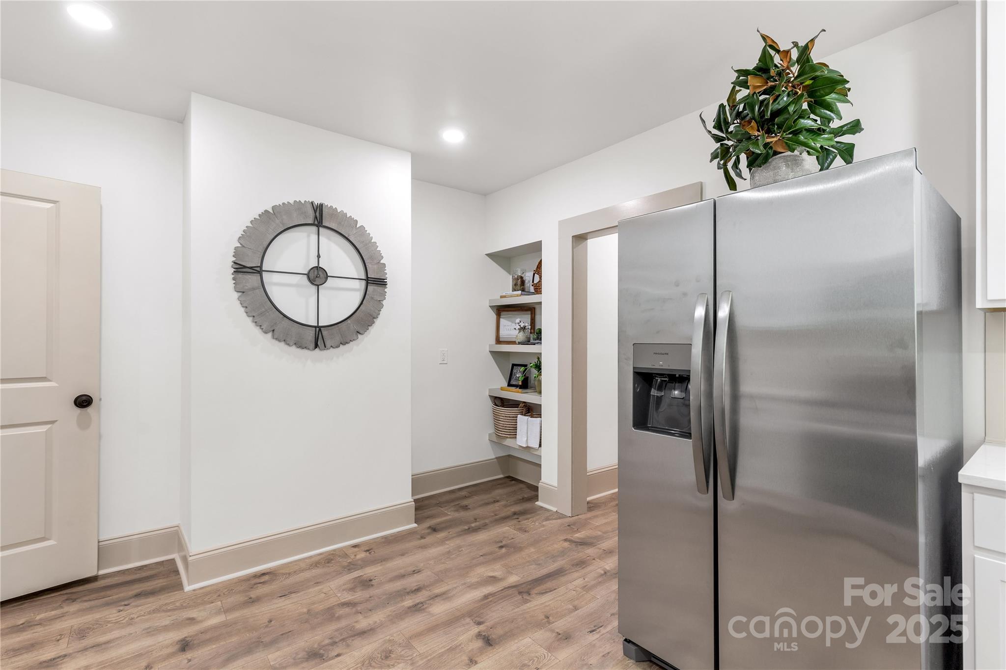 310 Elm Street Lancaster, SC 29720 - Photo 19 of 48 a view of a room with wooden floor staircase and a living room