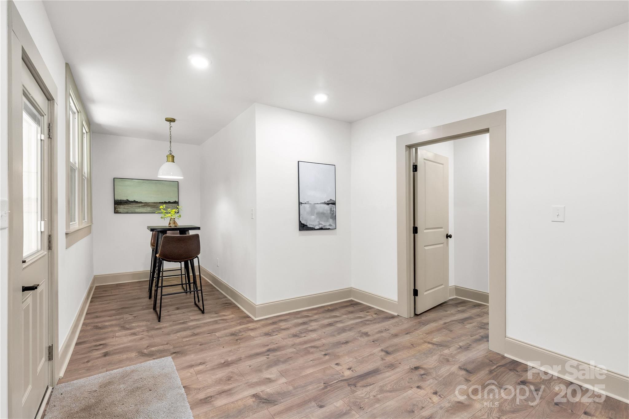 310 Elm Street Lancaster, SC 29720 - Photo 21 of 48 a view of a livingroom with wooden floor and furniture
