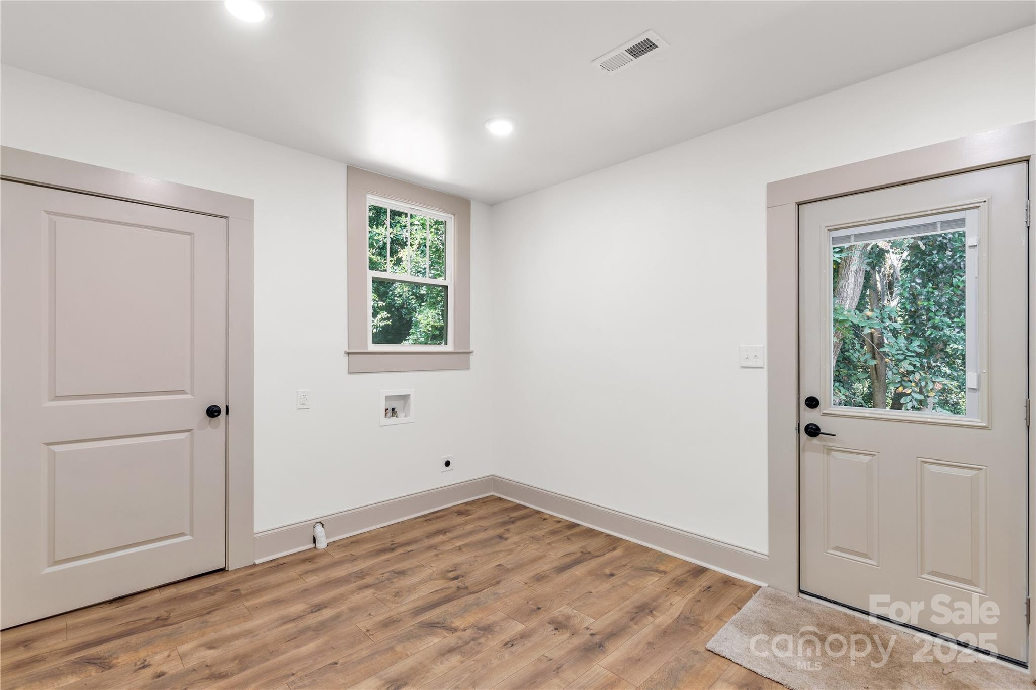 310 Elm Street Lancaster, SC 29720 - Photo 23 of 48 a view of empty room with wooden floor and fan