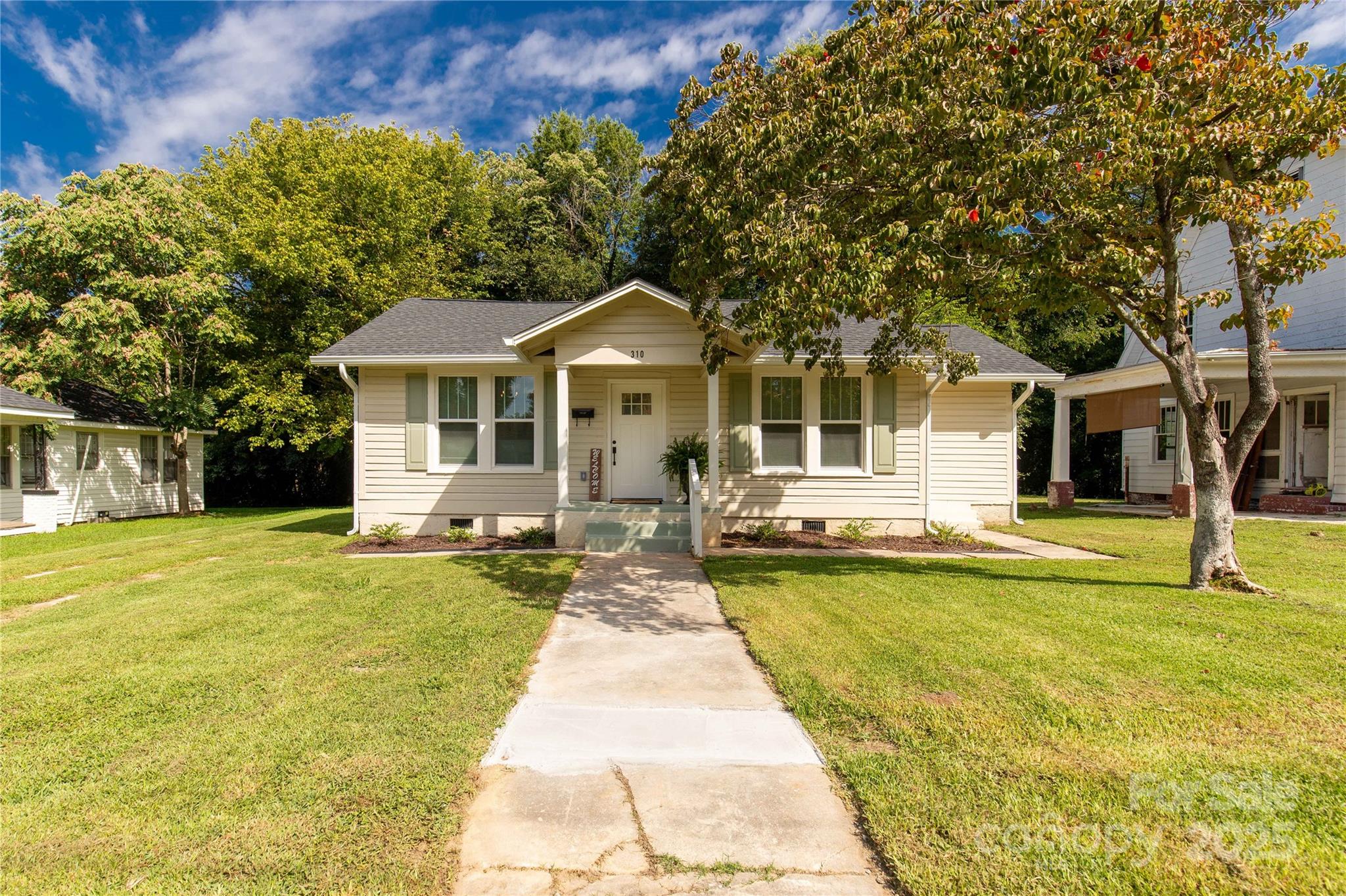 310 Elm Street Lancaster, SC 29720 - Photo 25 of 48 a front view of a house with swimming pool