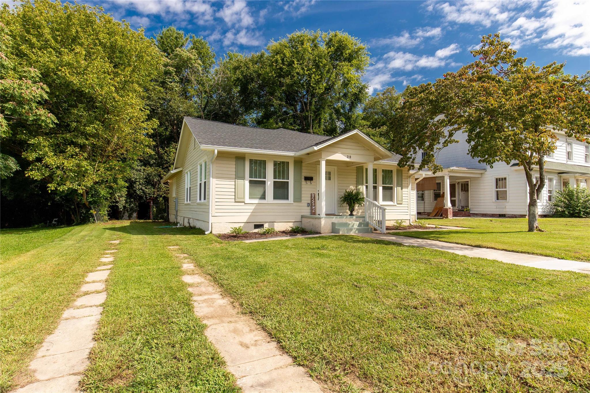 310 Elm Street Lancaster, SC 29720 - Photo 26 of 48 a front view of a house with swimming pool