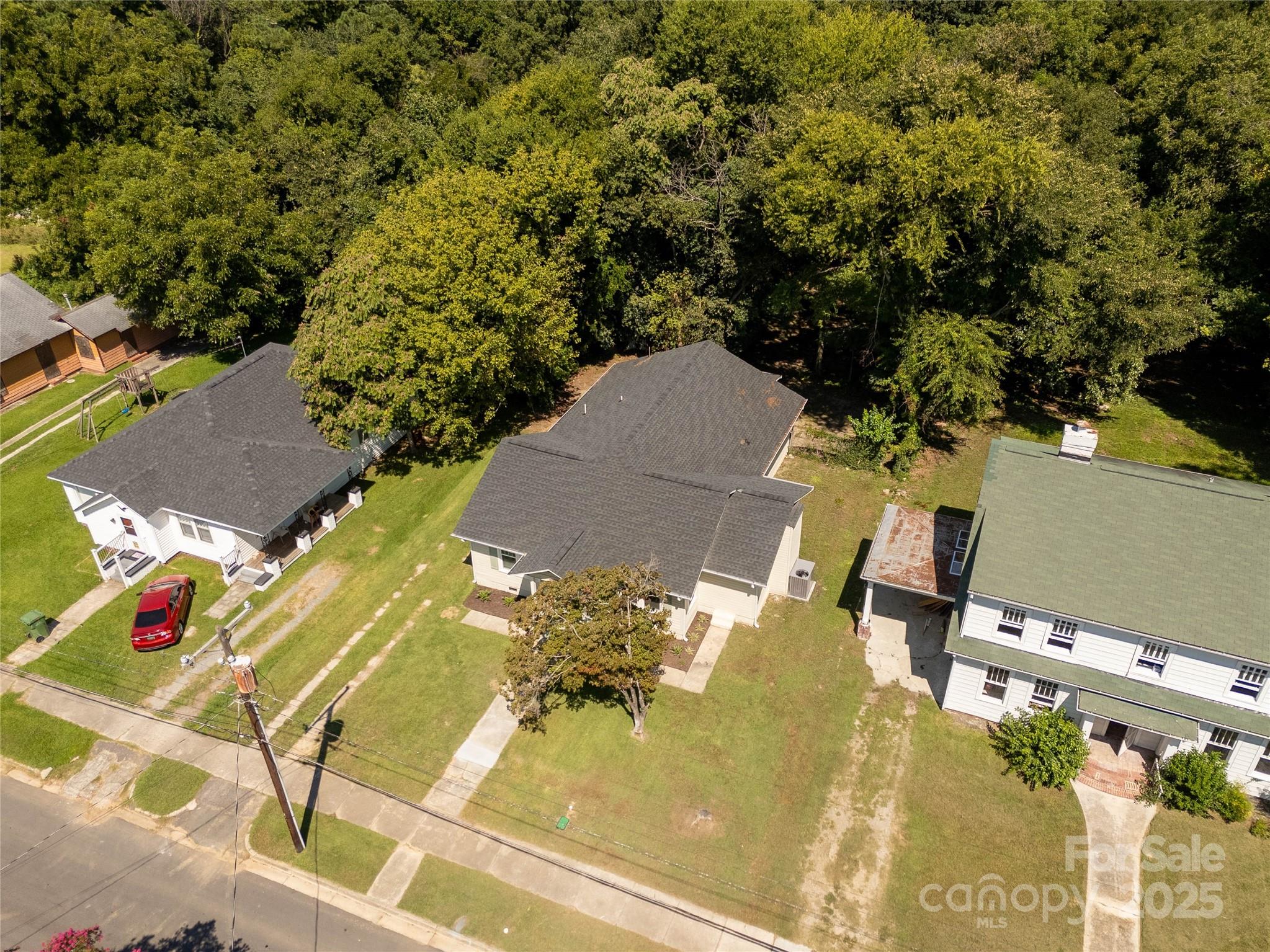 310 Elm Street Lancaster, SC 29720 - Photo 31 of 48 an aerial view of residential houses with outdoor space