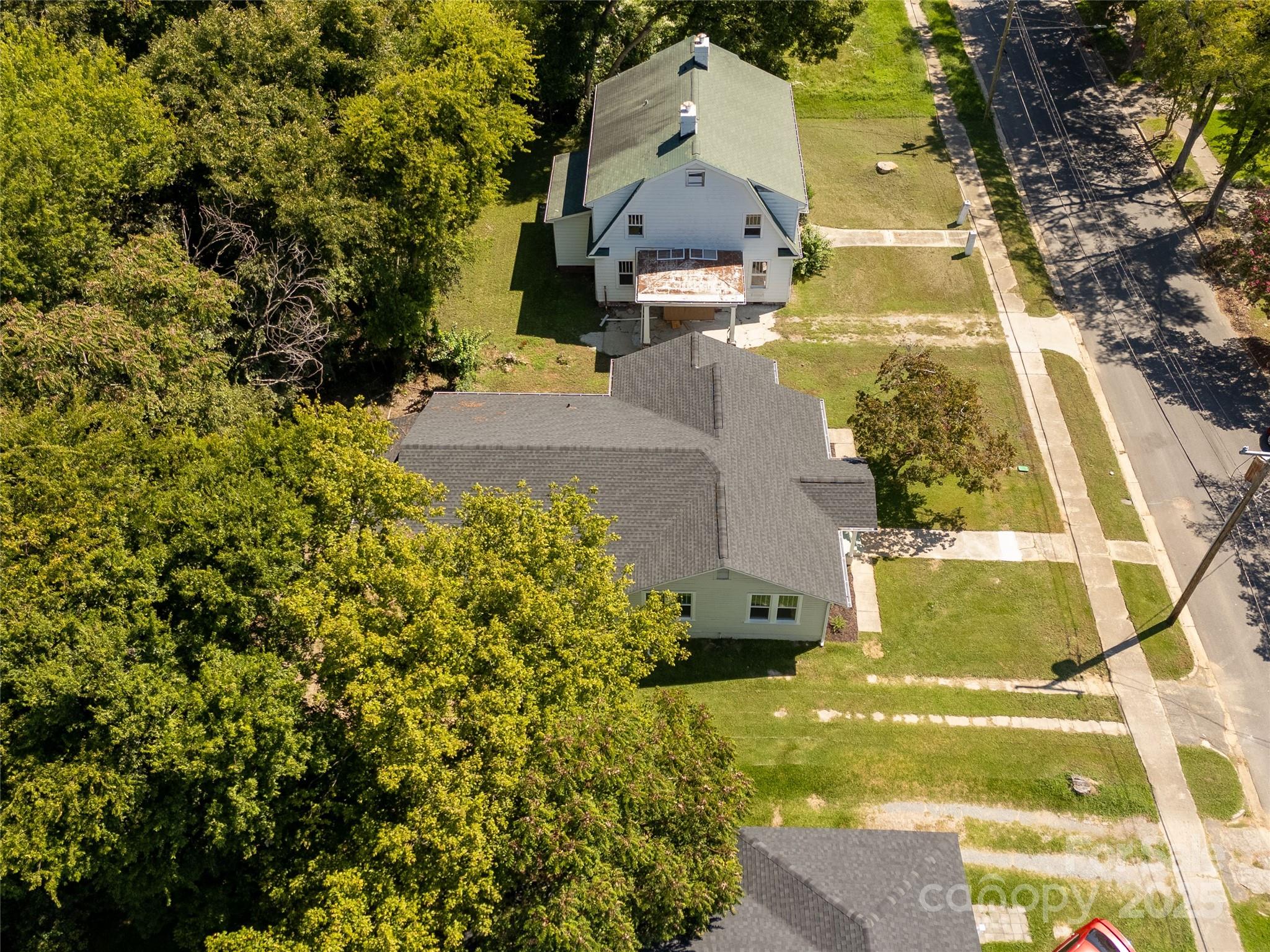 310 Elm Street Lancaster, SC 29720 - Photo 34 of 48 a view of a yard with plants and large trees