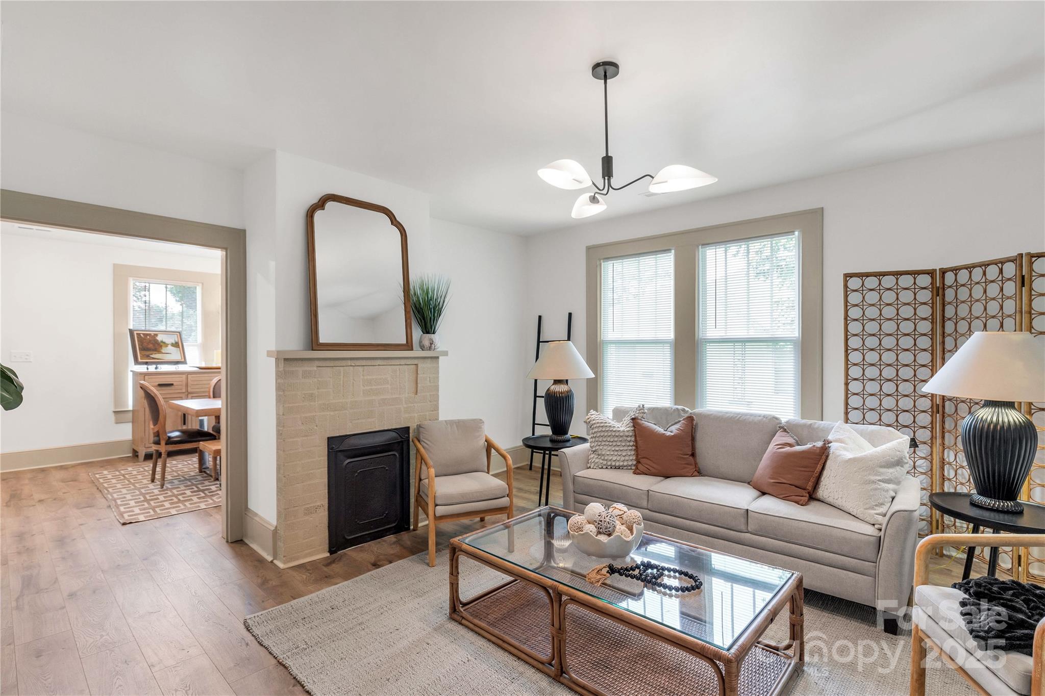 310 Elm Street Lancaster, SC 29720 - Photo 9 of 48 a living room with furniture a fireplace and a table