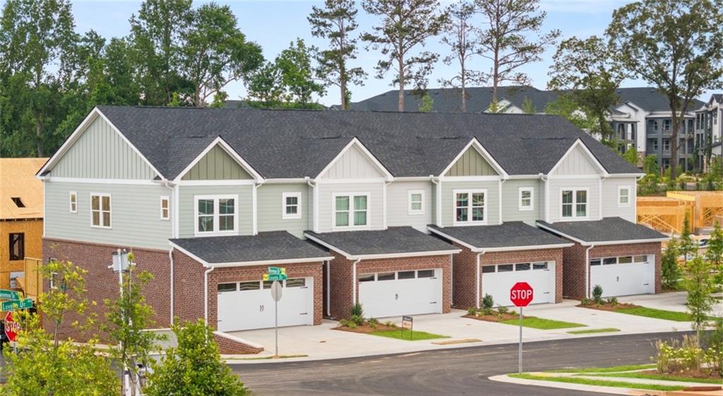 100 Rosemoore Drive Covington, GA 30014 - Photo 2 of 41 a front view of a house with a garden