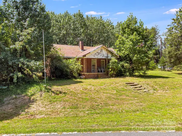 a house with swimming pool in front of it