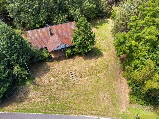 an aerial view of residential house with outdoor space