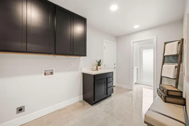 a kitchen with a sink and a mirror
