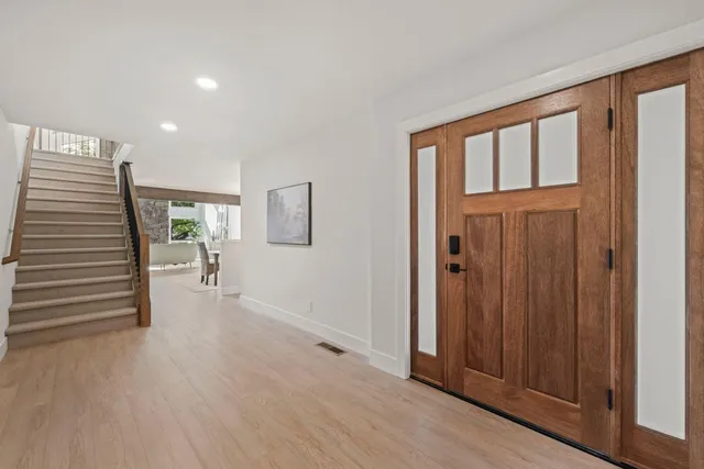 a view of a livingroom with furniture and hardwood floor