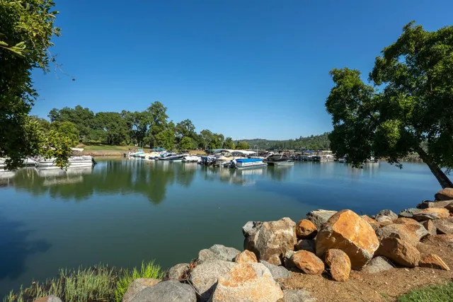 an aerial view of a house with lake view