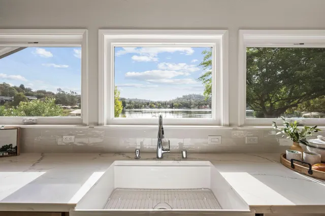 a bathroom with a bathtub and window