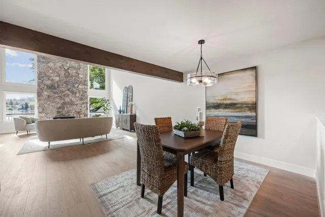 a view of a dining room with furniture window and wooden floor