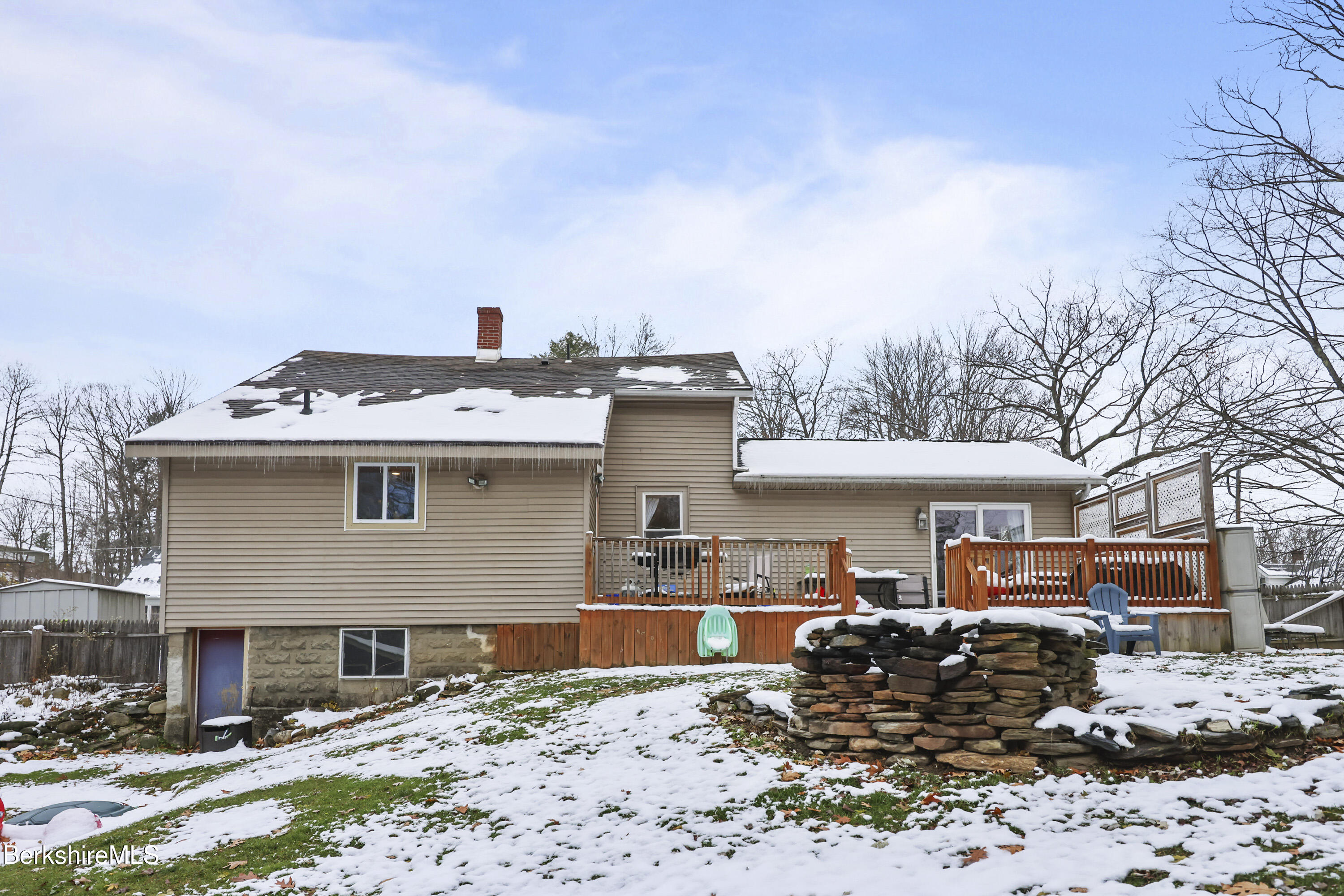 55 Newton Avenue Pittsfield, MA 01201 - Photo 24 of 30 a front view of a house with a yard covered in snow