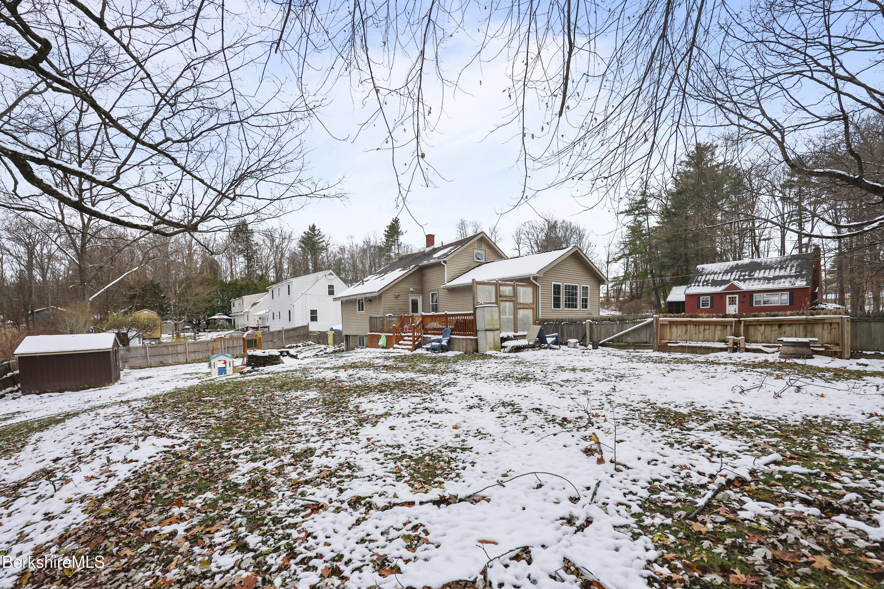 55 Newton Avenue Pittsfield, MA 01201 - Photo 27 of 30 a view of a house with a yard covered in snow