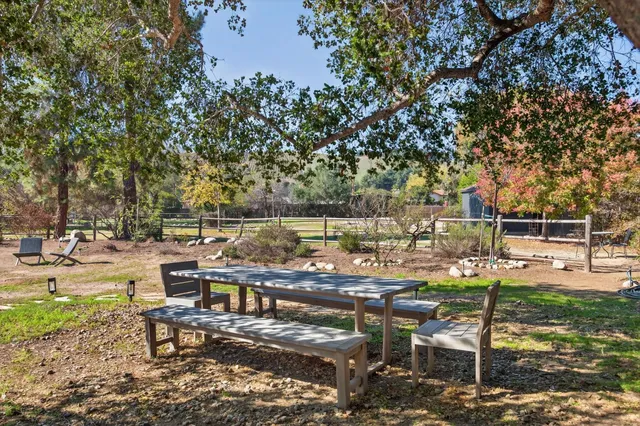 a view of a lake with sitting area