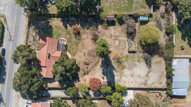 an aerial view of residential houses with outdoor space