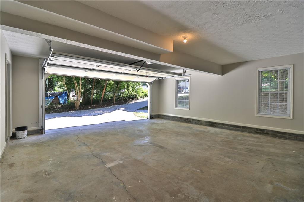 353 Fall View Court Winder, GA 30680 - Photo 11 of 61 a view of empty room with wooden floor and fan