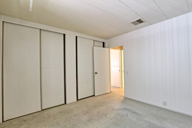 a bathroom with a granite countertop sink mirror and a