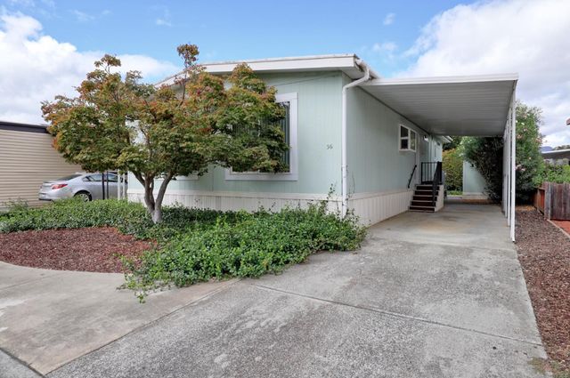 a lobby with furniture and potted plant