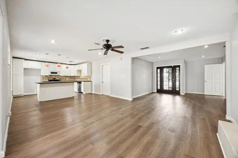 a view of a kitchen with a sink and a stove top oven