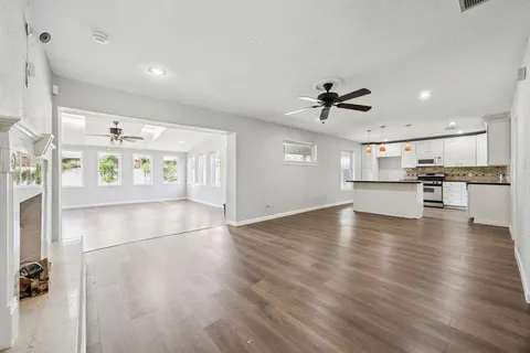 a view of a kitchen with a sink and a stove top oven