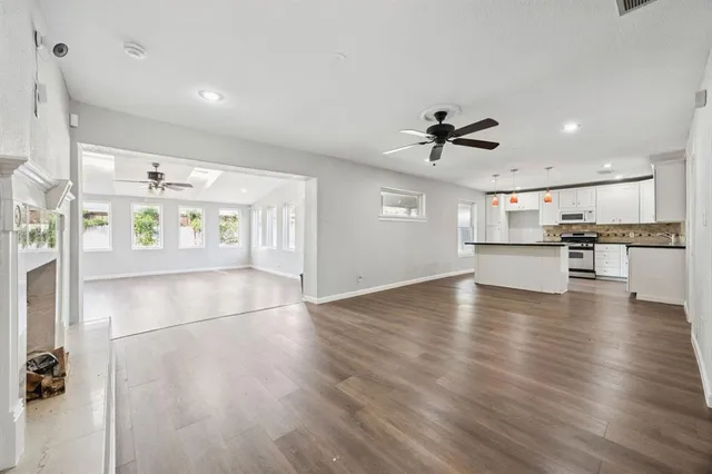 a view of a kitchen with a sink and a stove top oven