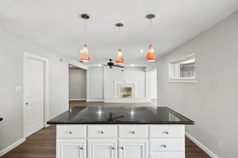 a kitchen view of a granite counter top