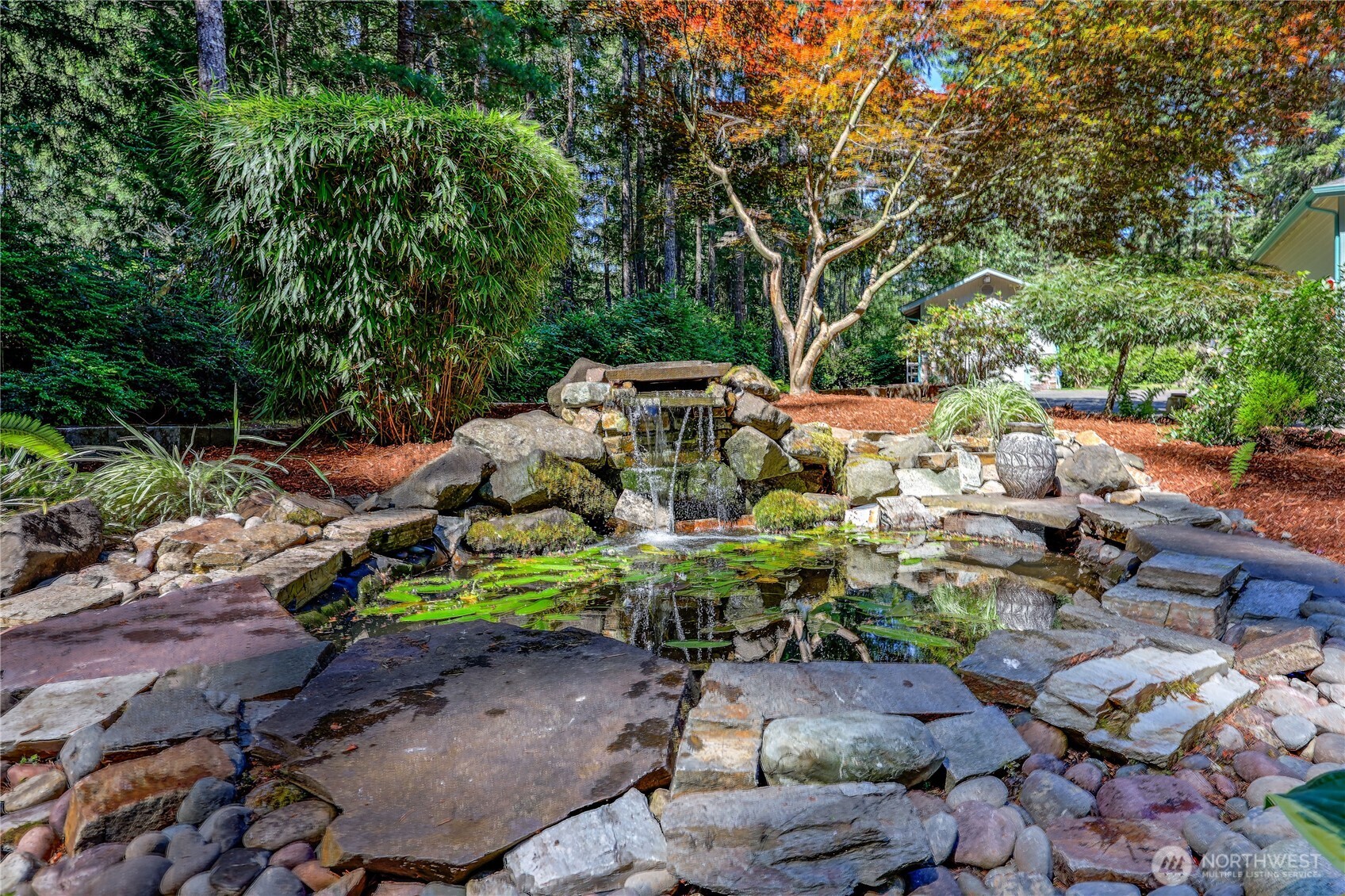 4354 Northwest Westgate Road Silverdale, WA 98383 - Photo 35 of 40 a backyard of a house with lots of green space