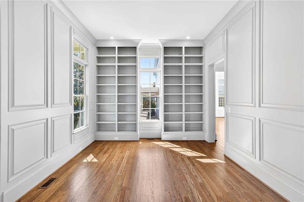 2147 Cooper Lake Road Southeast Smyrna, GA 30080 - Photo 14 of 65 an empty room with wooden floor and windows