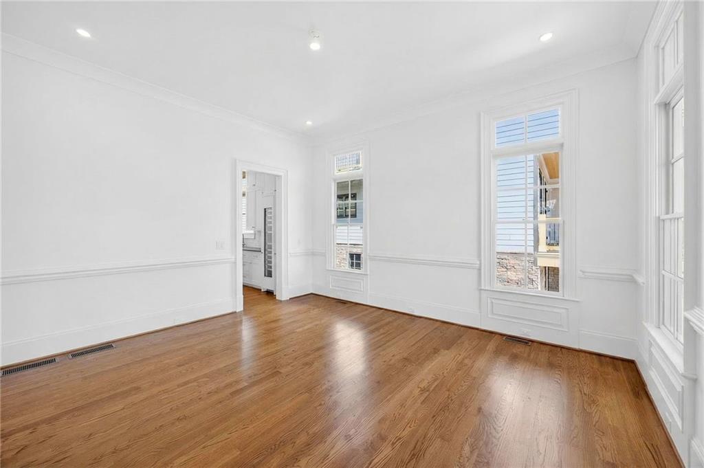 2147 Cooper Lake Road Southeast Smyrna, GA 30080 - Photo 15 of 65 an empty room with wooden floor and window