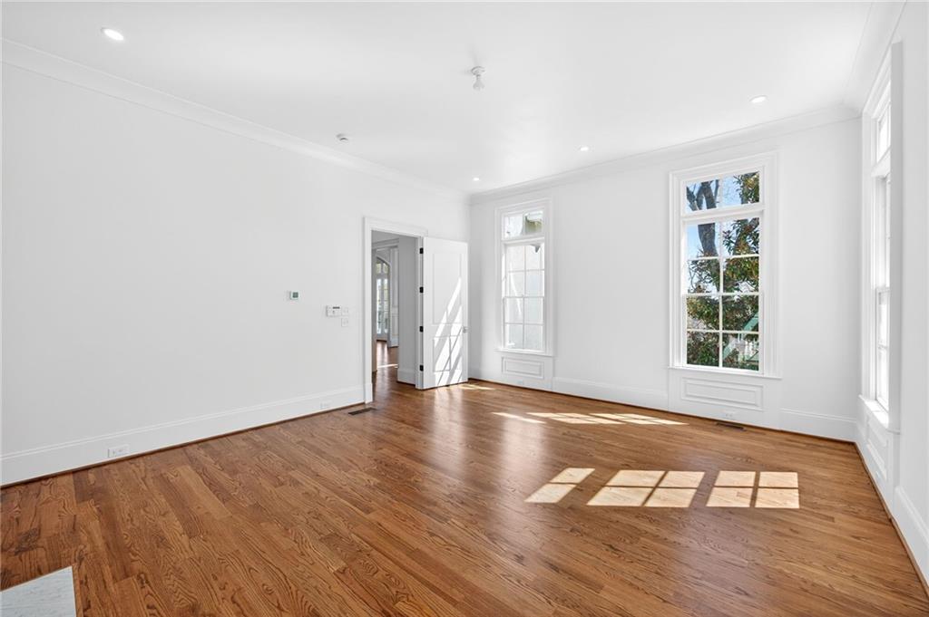 2147 Cooper Lake Road Southeast Smyrna, GA 30080 - Photo 21 of 65 a view of an empty room with wooden floor and a window
