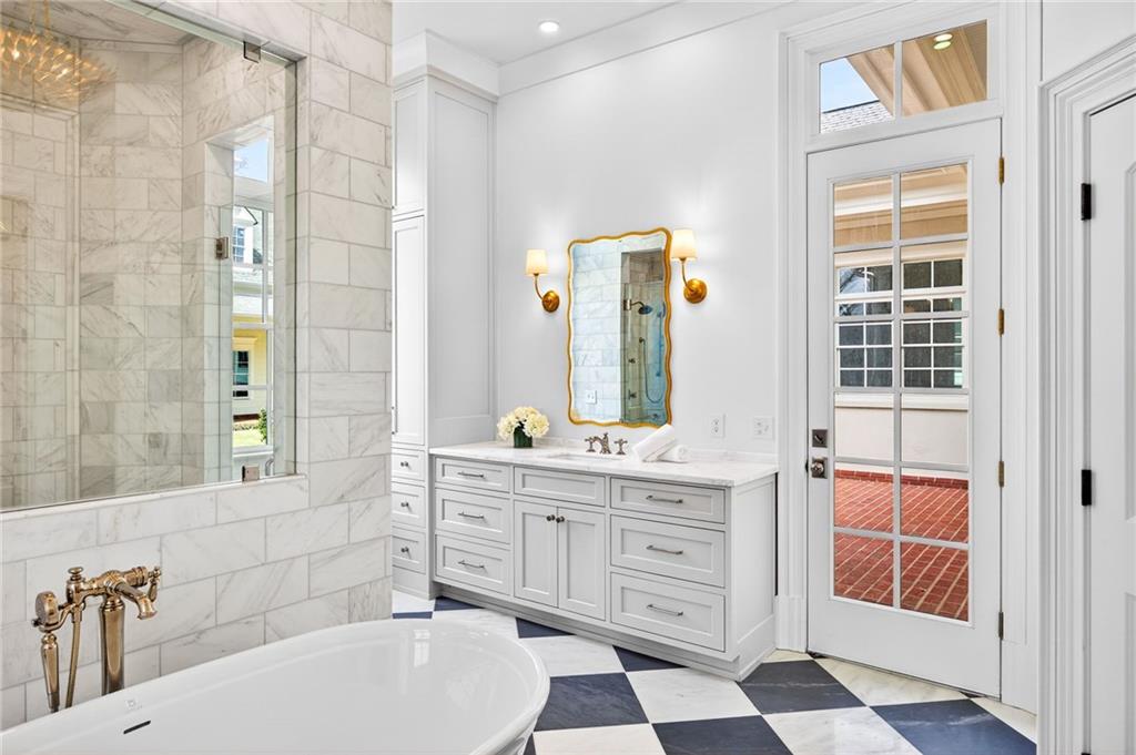 2147 Cooper Lake Road Southeast Smyrna, GA 30080 - Photo 26 of 65 a bathroom with a sink a toilet a mirror and shower