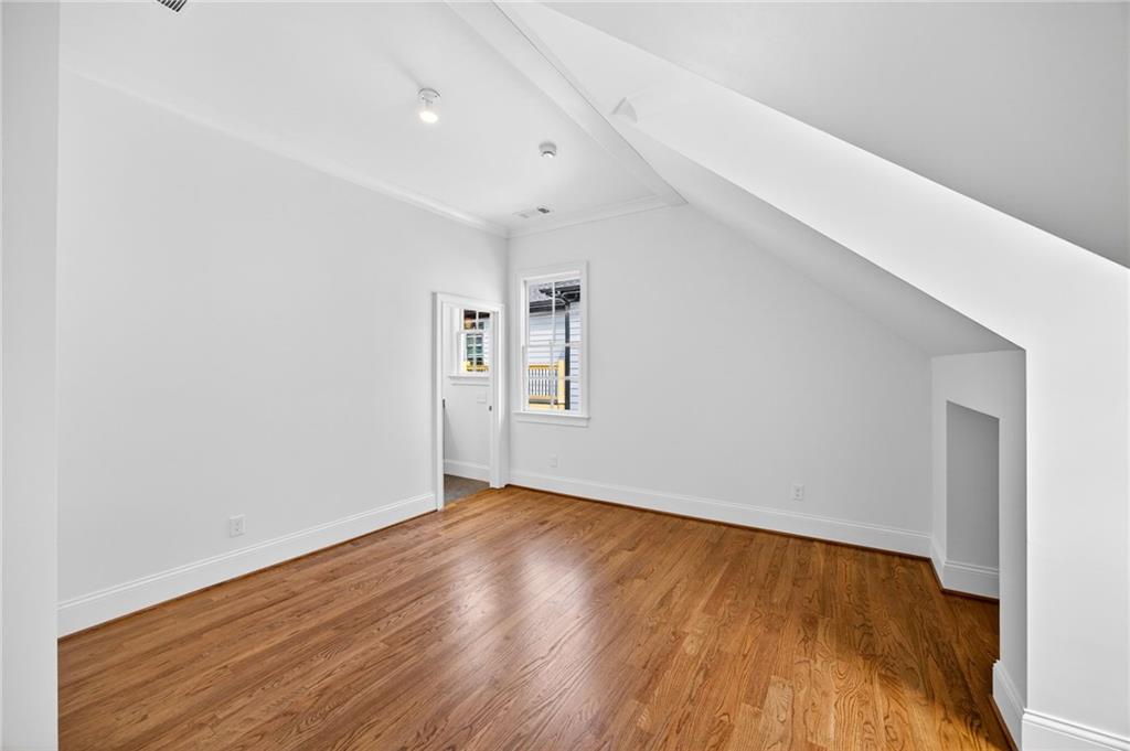 2147 Cooper Lake Road Southeast Smyrna, GA 30080 - Photo 31 of 65 a view of an empty room with wooden floor and a window