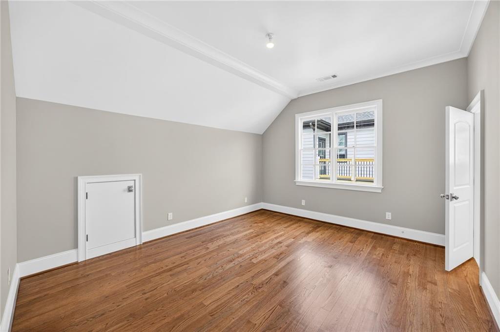2147 Cooper Lake Road Southeast Smyrna, GA 30080 - Photo 35 of 65 an empty room with wooden floor and windows
