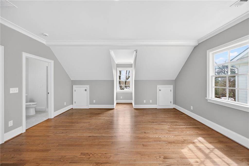 2147 Cooper Lake Road Southeast Smyrna, GA 30080 - Photo 41 of 65 a view of an empty room with a window and wooden floor