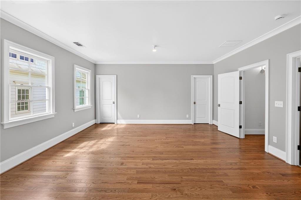 2147 Cooper Lake Road Southeast Smyrna, GA 30080 - Photo 42 of 65 a view of an empty room with window and wooden floor