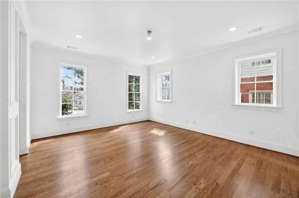 2147 Cooper Lake Road Southeast Smyrna, GA 30080 - Photo 45 of 65 a view of an empty room with wooden floor and a window