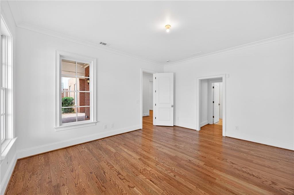 2147 Cooper Lake Road Southeast Smyrna, GA 30080 - Photo 48 of 65 an empty room with wooden floor and windows