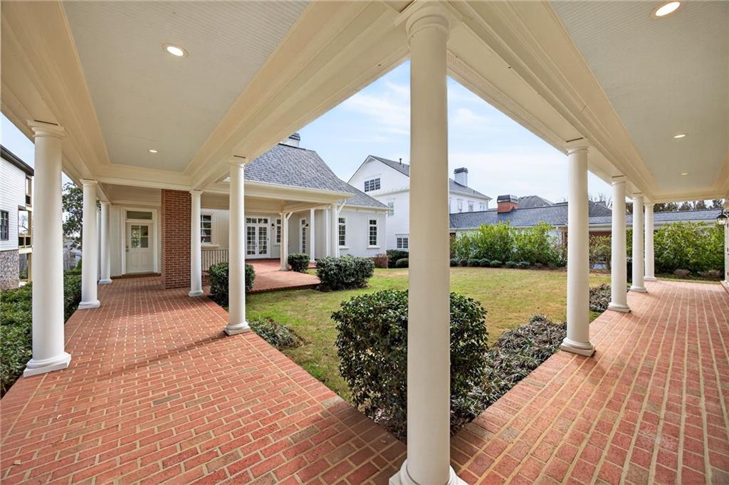 2147 Cooper Lake Road Southeast Smyrna, GA 30080 - Photo 59 of 65 a front view of a house with yard and glass windows