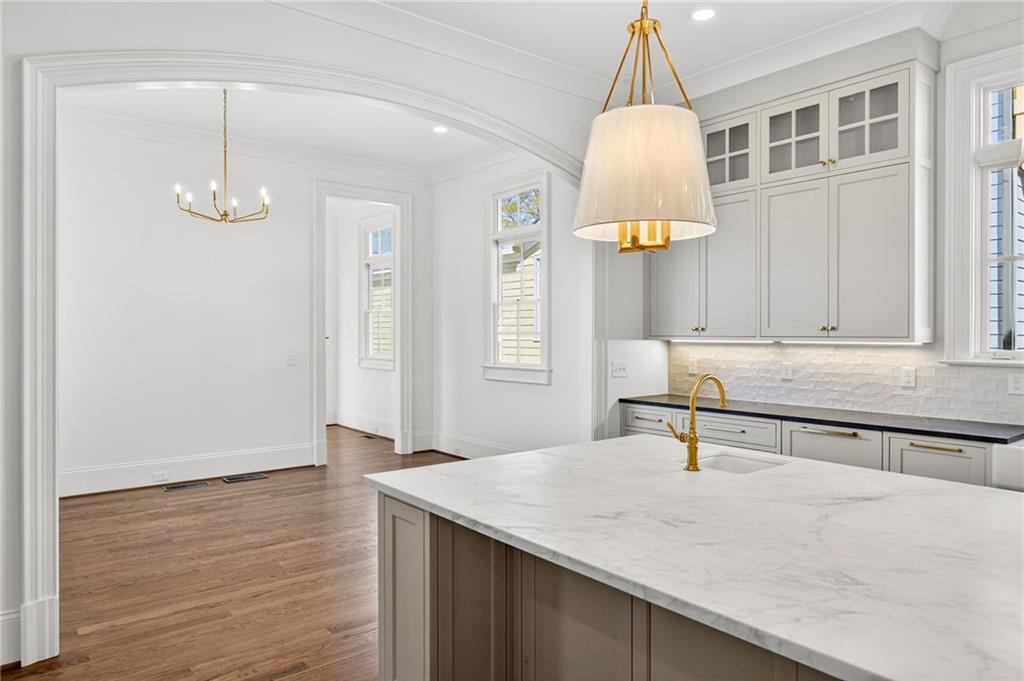 2147 Cooper Lake Road Southeast Smyrna, GA 30080 - Photo 9 of 65 a view of a kitchen center island and wooden floor