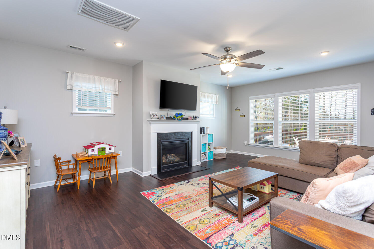 1708 Highpoint Street Wake Forest, NC 27587 - Photo 12 of 63 a living room with furniture fireplace and flat screen tv