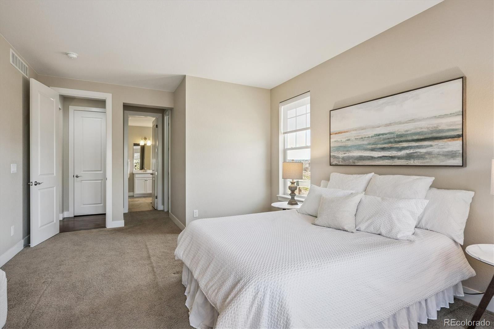 6667 Club Villa Road Parker, CO 80134 - Photo 23 of 50 a bedroom with a bed and a painting