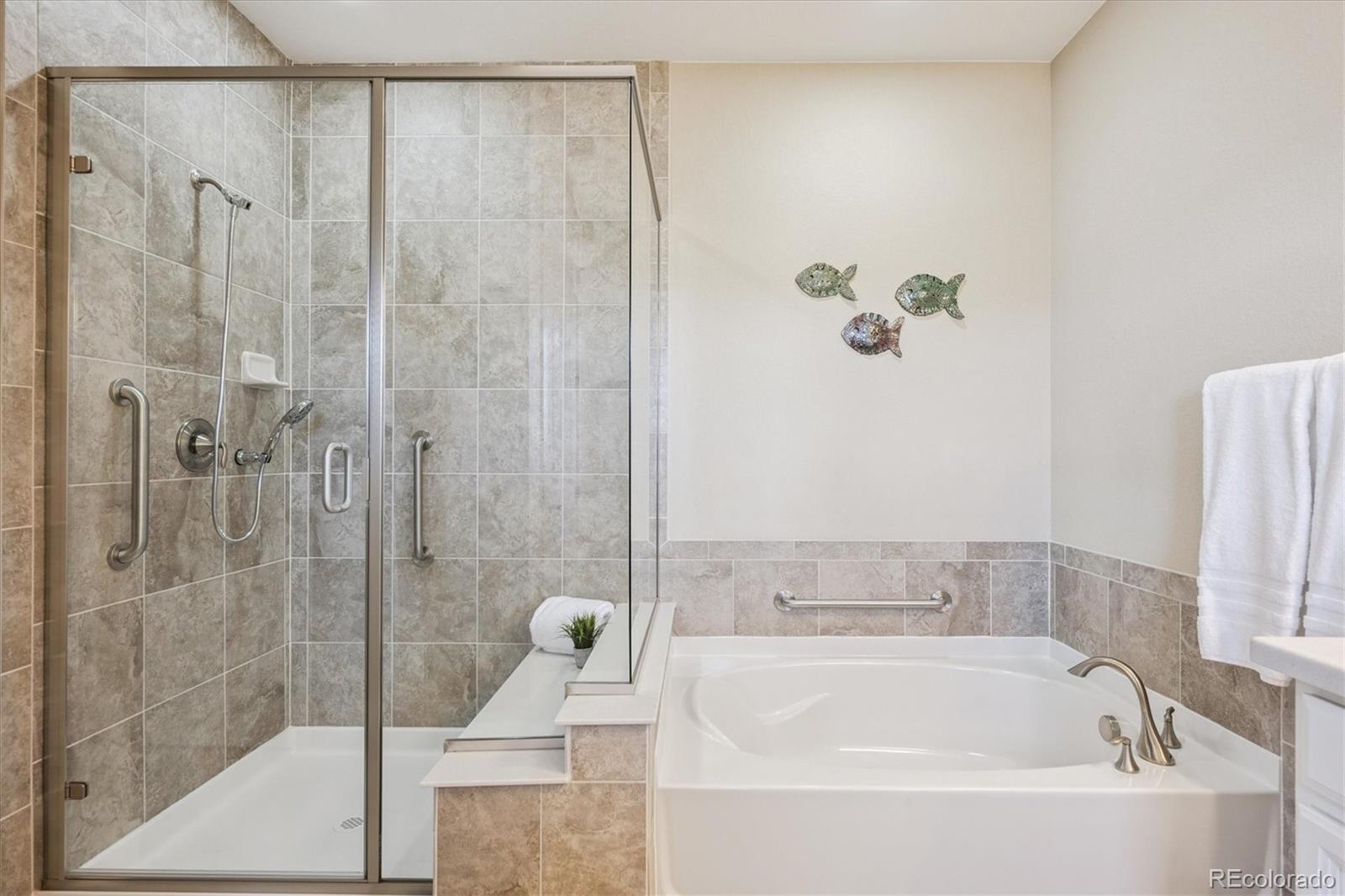 6667 Club Villa Road Parker, CO 80134 - Photo 25 of 50 a bathroom with a bathtub and shower